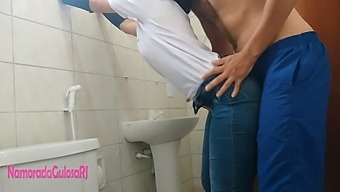 In A Company Restroom, Two Individuals Engage In Sexual Activity, Fervently Hoping To Maintain Confidentiality